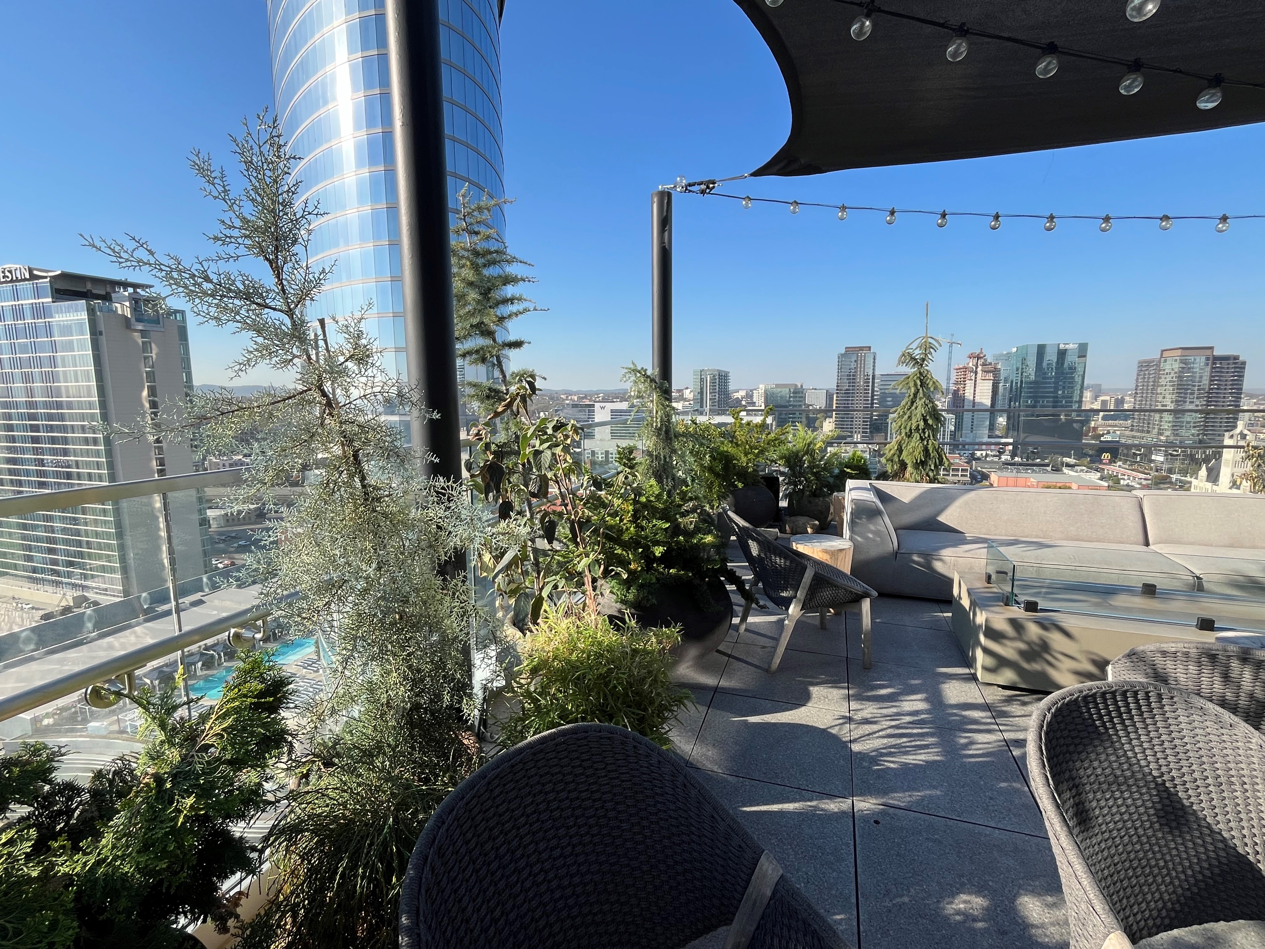 Rooftop patio with chairs and plants